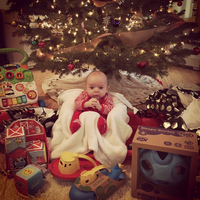 christmas morning with this sweetie! and if you can't tell, he's sitting on a new  toboggan....thanks santa :) ?